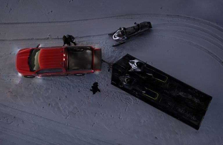 2021_Ford_F-150_parked_on_snow_lights_view_o