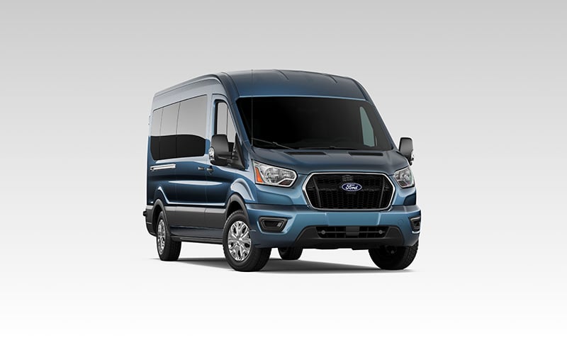 Blue Ford Transit passenger van displayed on a white background at Metro Ford Calgary.