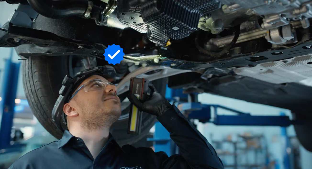 Technician working on a truck engine