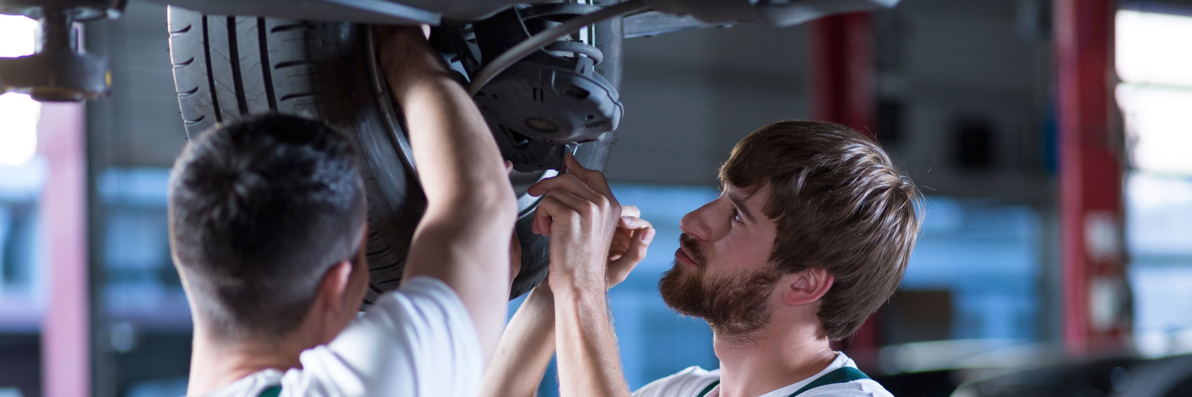 Two Mechanics Fixing Car