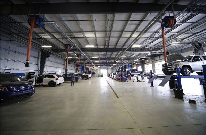 Technicians at work in Heartland Ford's service bay