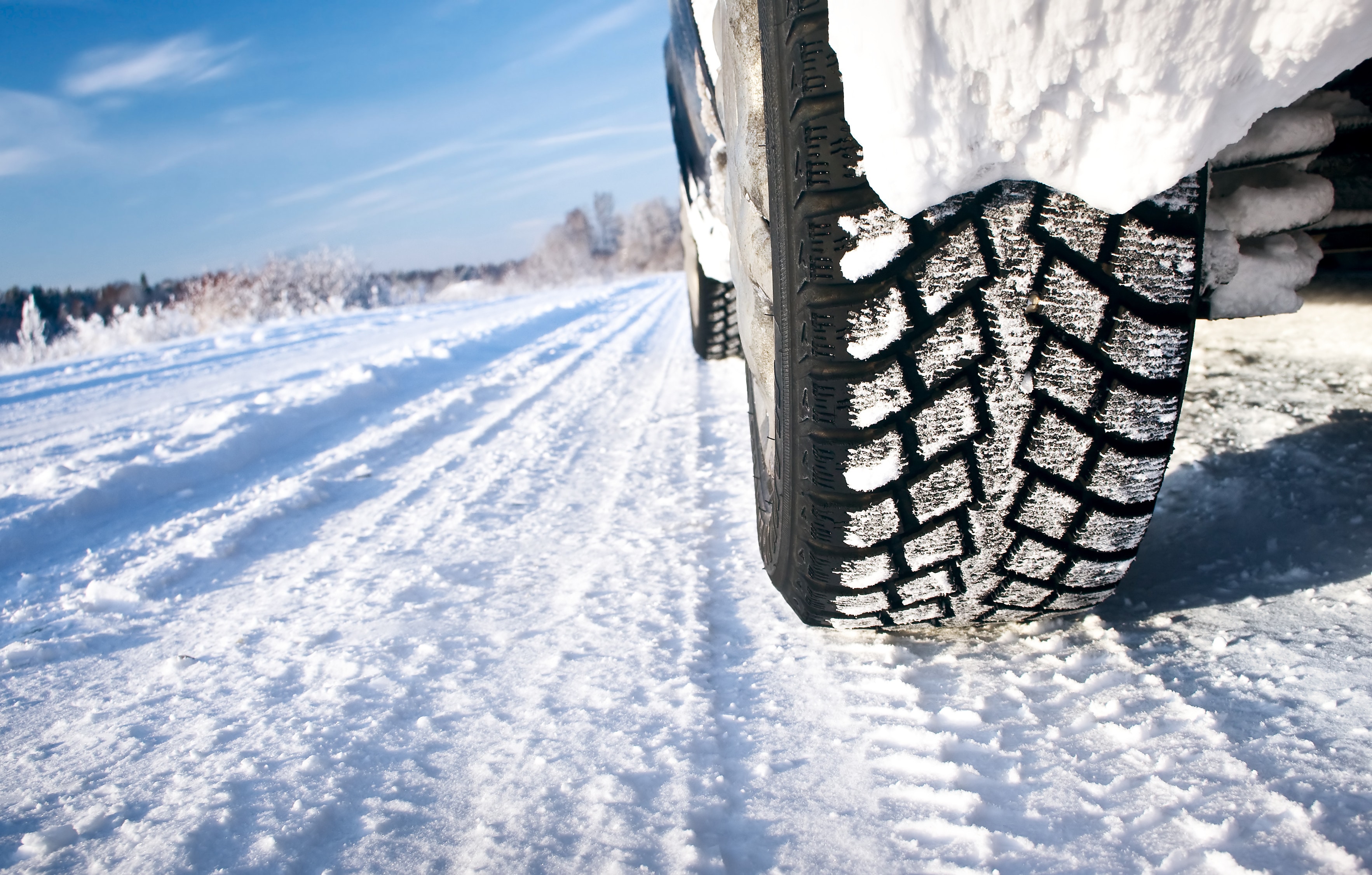 car driving with winter tires through snow